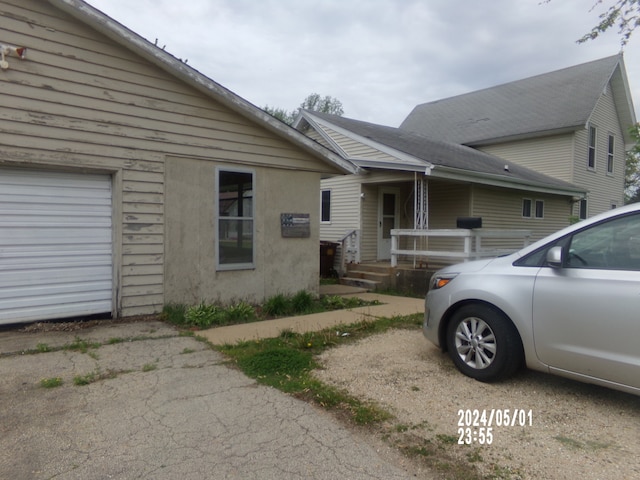 view of side of property featuring a garage