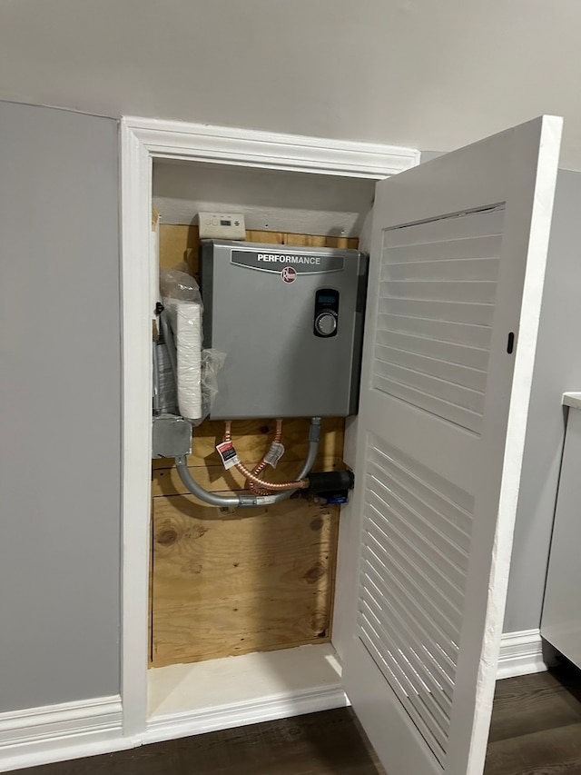 utility room with electric water heater