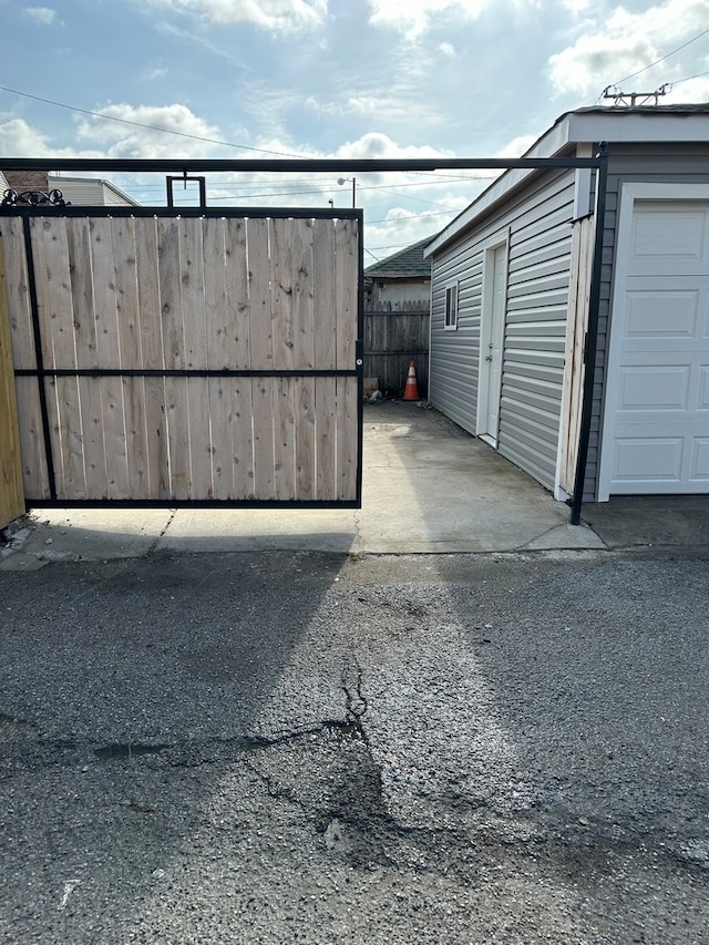 view of gate featuring an outdoor structure