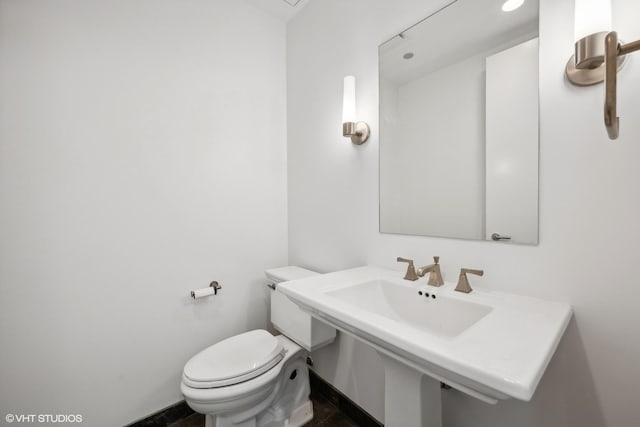 bathroom with toilet and sink