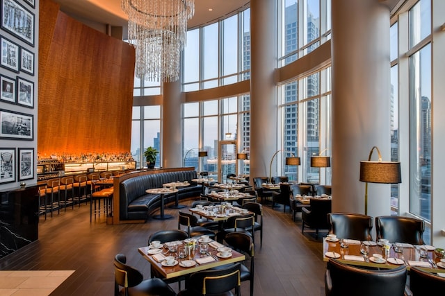 interior space featuring a towering ceiling and a chandelier