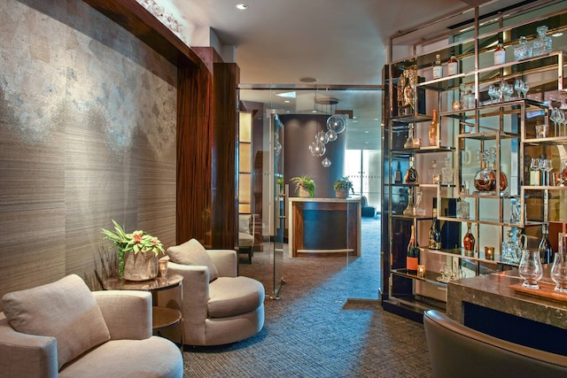 sitting room with carpet floors