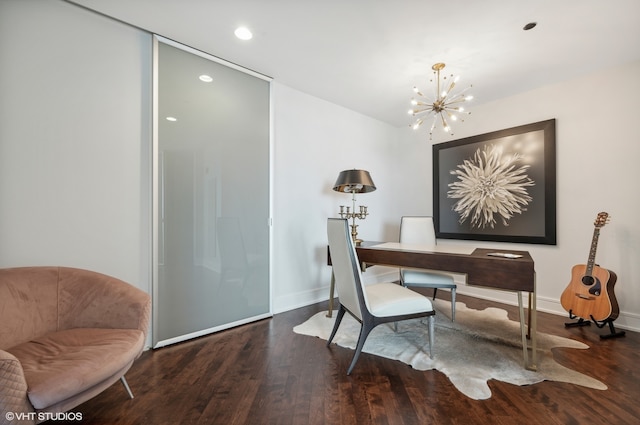 office space featuring a notable chandelier and hardwood / wood-style floors