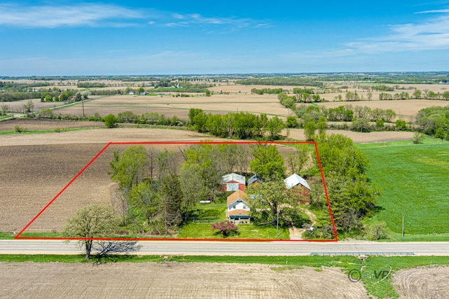 birds eye view of property with a rural view