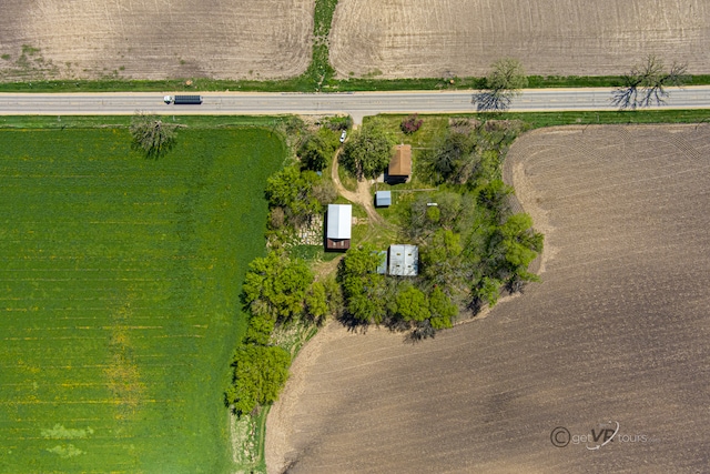 birds eye view of property with a rural view