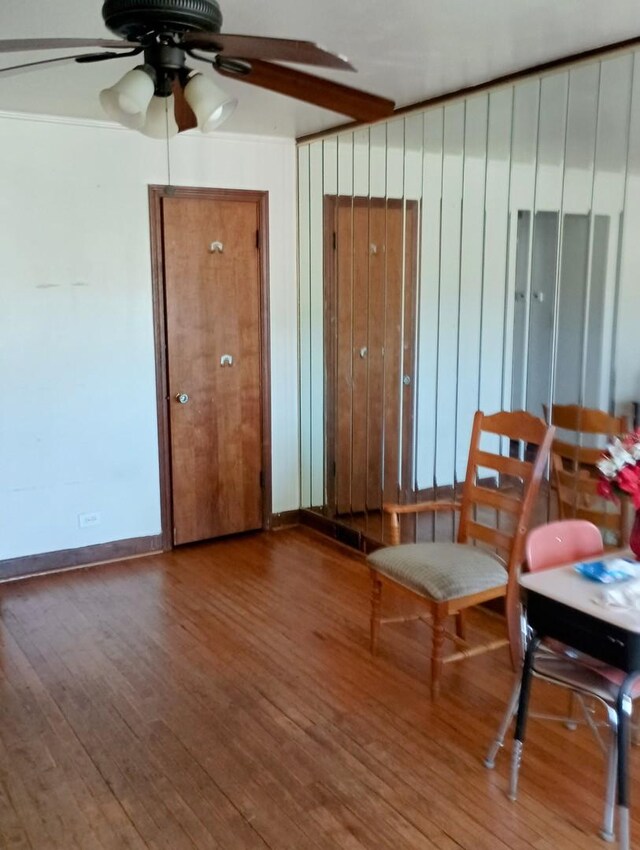 unfurnished room featuring hardwood / wood-style flooring and ceiling fan