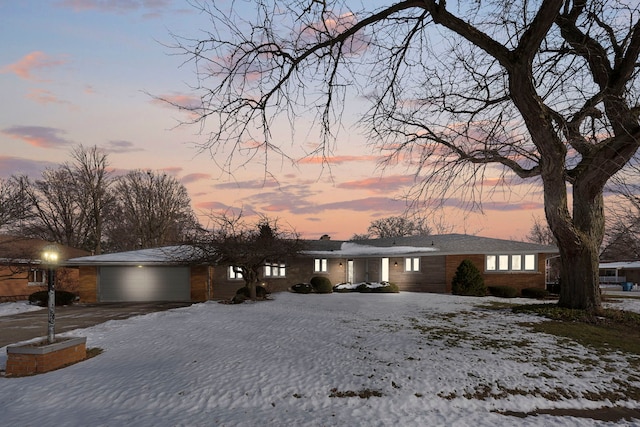 single story home featuring a garage