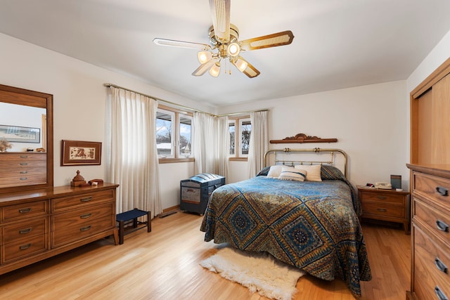 bedroom with ceiling fan and light wood-type flooring