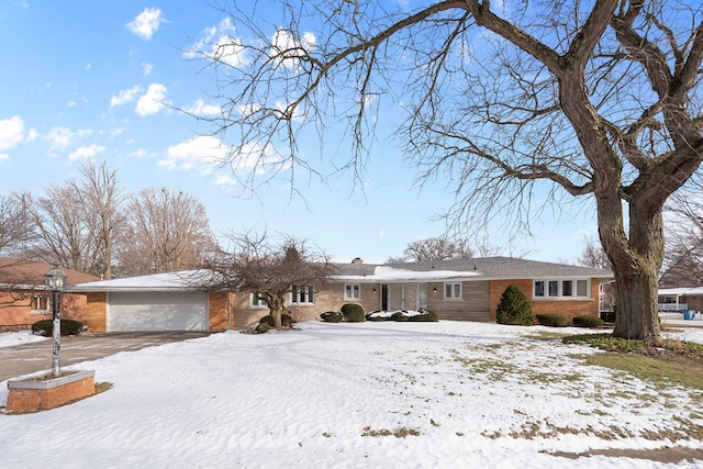 single story home featuring a garage