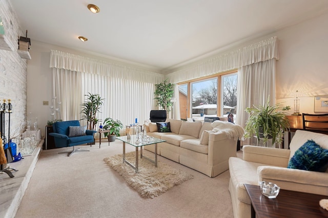 carpeted living room featuring a fireplace