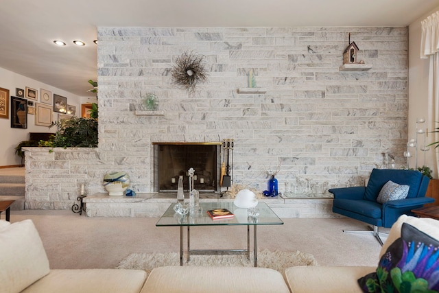 carpeted living room featuring a fireplace