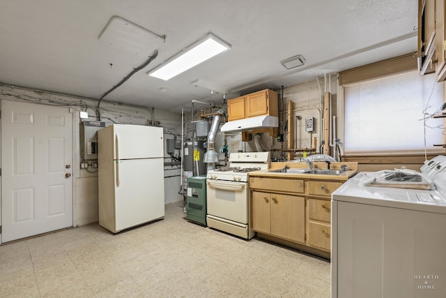 kitchen featuring light brown cabinets, washing machine and dryer, white appliances, sink, and light tile floors