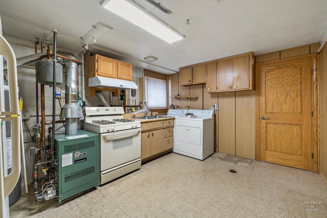 kitchen with sink, separate washer and dryer, light tile floors, and gas range gas stove