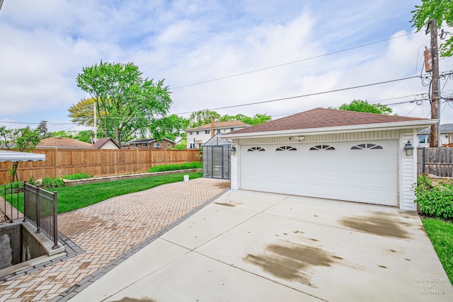 garage featuring a yard