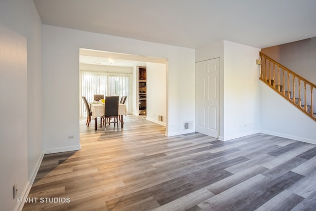 unfurnished room featuring hardwood / wood-style flooring