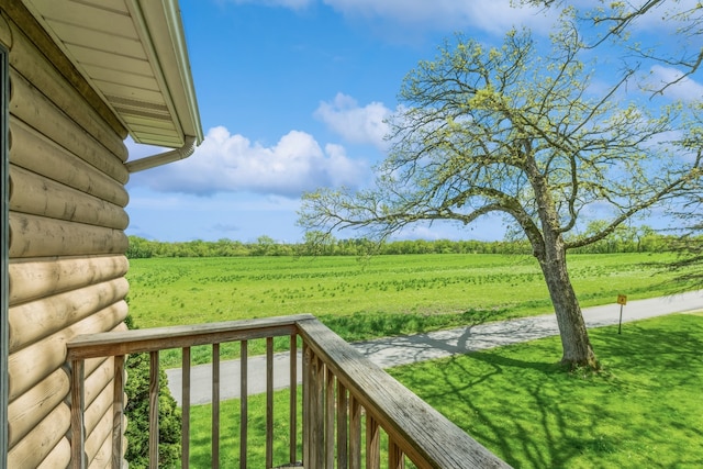 view of yard with a rural view