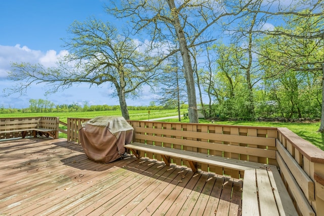 wooden terrace with a grill