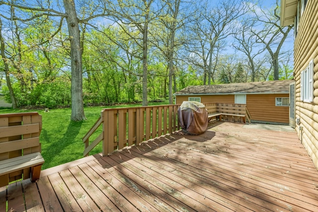 wooden deck with a yard