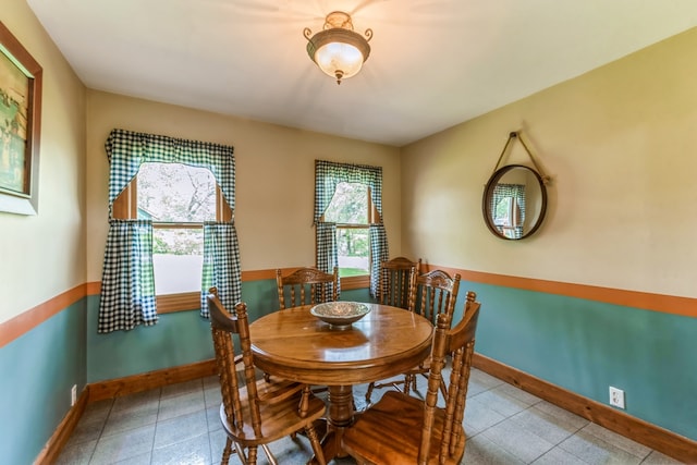 dining space featuring tile flooring