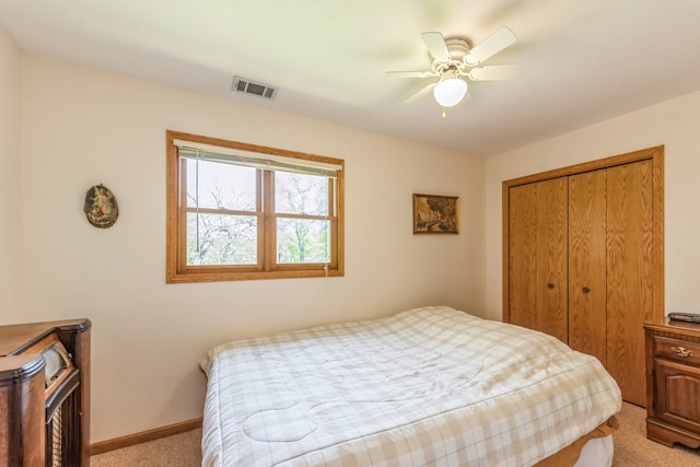 bedroom featuring carpet flooring, a closet, and ceiling fan