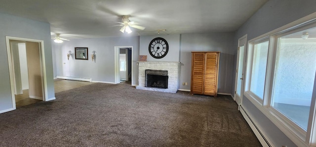 unfurnished living room featuring a brick fireplace, a baseboard radiator, and dark carpet