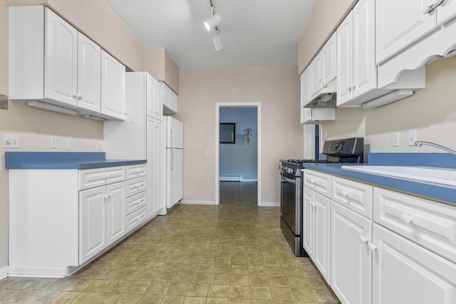 kitchen with sink, white cabinetry, white fridge, stainless steel gas range, and a baseboard radiator