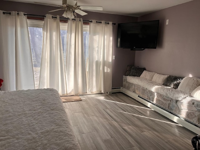 unfurnished bedroom featuring ceiling fan and baseboard heating