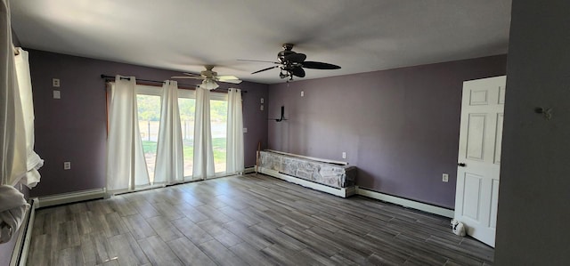 empty room with a baseboard radiator, ceiling fan, and hardwood / wood-style flooring