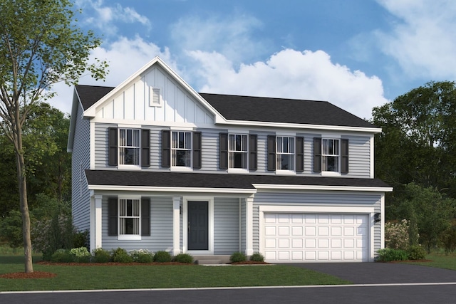 view of front of home featuring a garage and a front yard