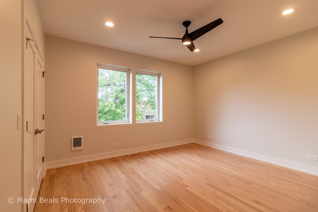 empty room featuring light hardwood / wood-style flooring and ceiling fan