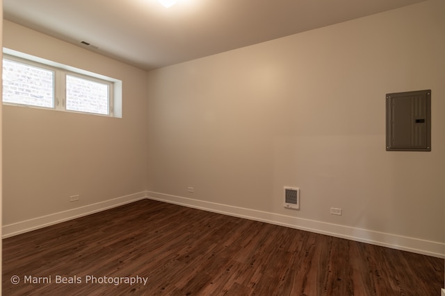 spare room featuring dark hardwood / wood-style flooring