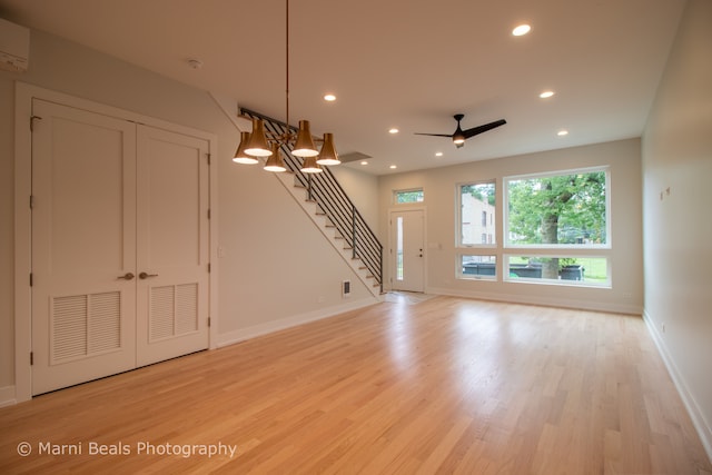 interior space featuring light hardwood / wood-style flooring and ceiling fan