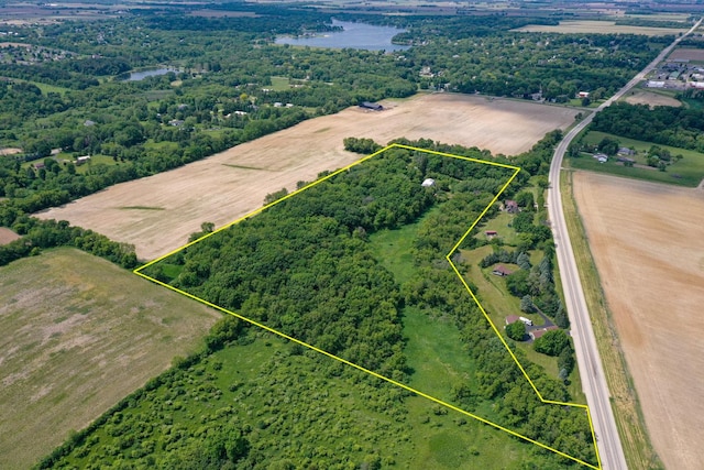 aerial view with a rural view and a water view