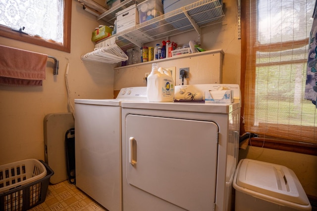 laundry area featuring laundry area, light floors, and separate washer and dryer