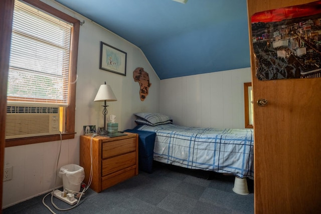 bedroom with lofted ceiling and cooling unit