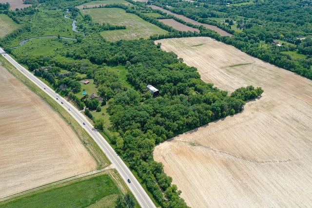 birds eye view of property featuring a rural view