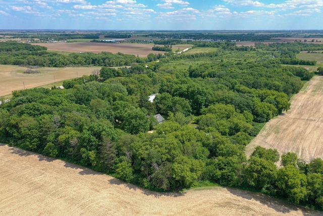 birds eye view of property featuring a rural view and a view of trees