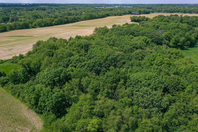 drone / aerial view featuring a forest view