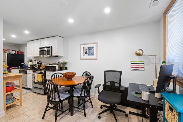 dining room with sink and light tile flooring