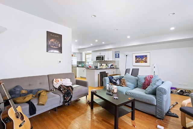 living room with light hardwood / wood-style floors