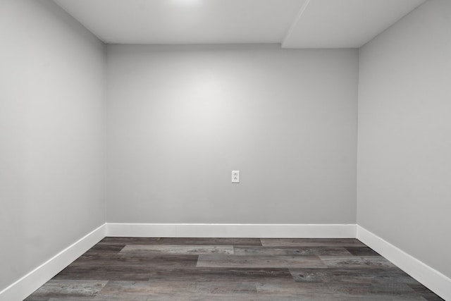 spare room with dark wood-type flooring