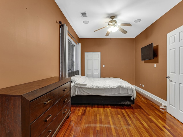 bedroom with wood-type flooring and ceiling fan