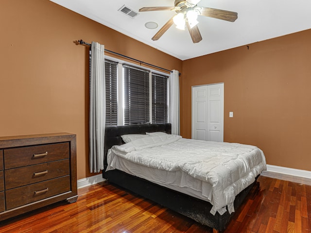 bedroom with ceiling fan and dark hardwood / wood-style floors