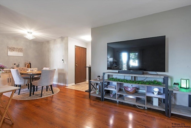 living room featuring baseboards and wood finished floors