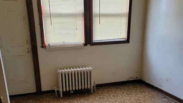 unfurnished room with radiator