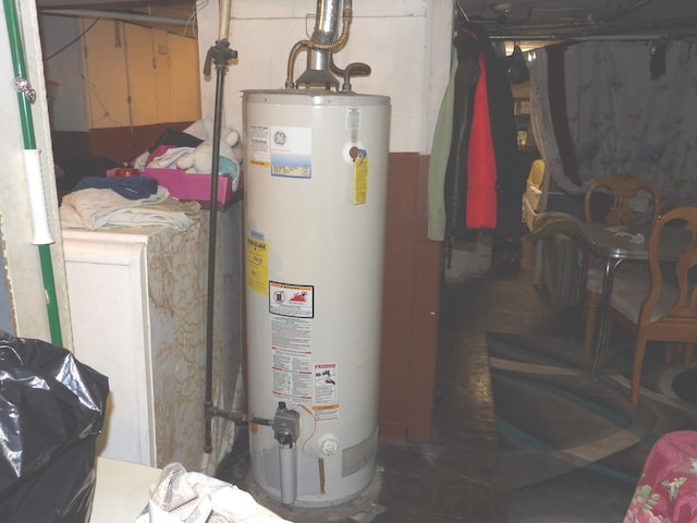 utility room featuring water heater