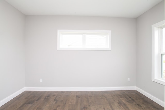 empty room with hardwood / wood-style floors