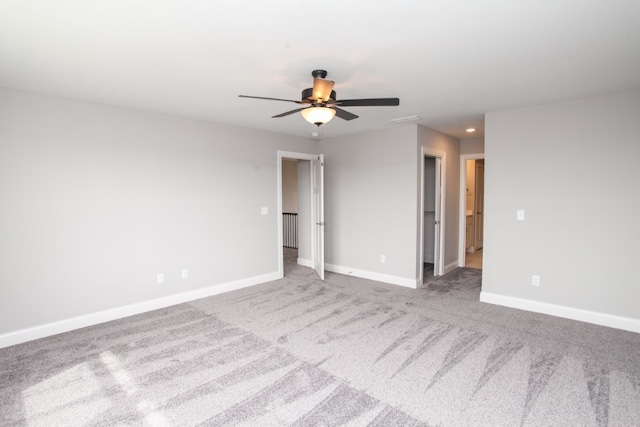 carpeted empty room with ceiling fan