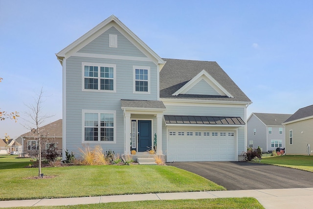 traditional-style home with a front lawn, a standing seam roof, aphalt driveway, a shingled roof, and metal roof