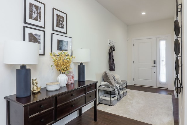 entrance foyer with dark wood finished floors and recessed lighting